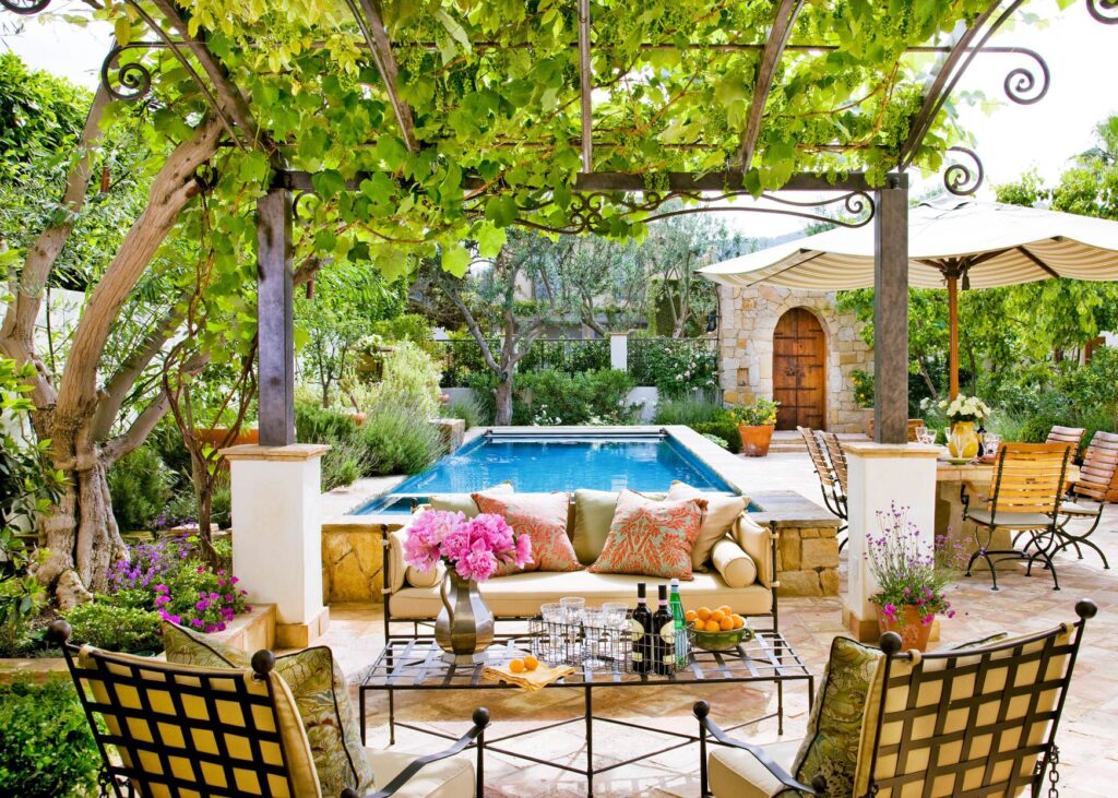 cozy sofas and chairs placed in a beautiful backyard