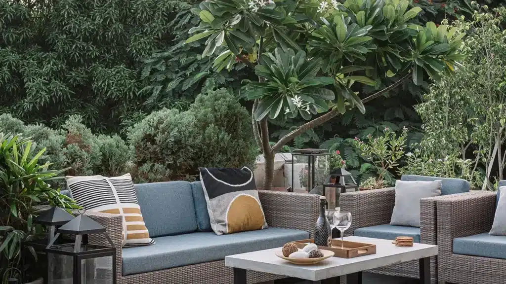 seating arranagement in a terrace garden with a sofa set and tables