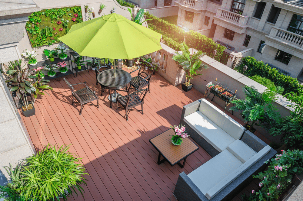 An overhead view of a balcony inside an apartment with plants